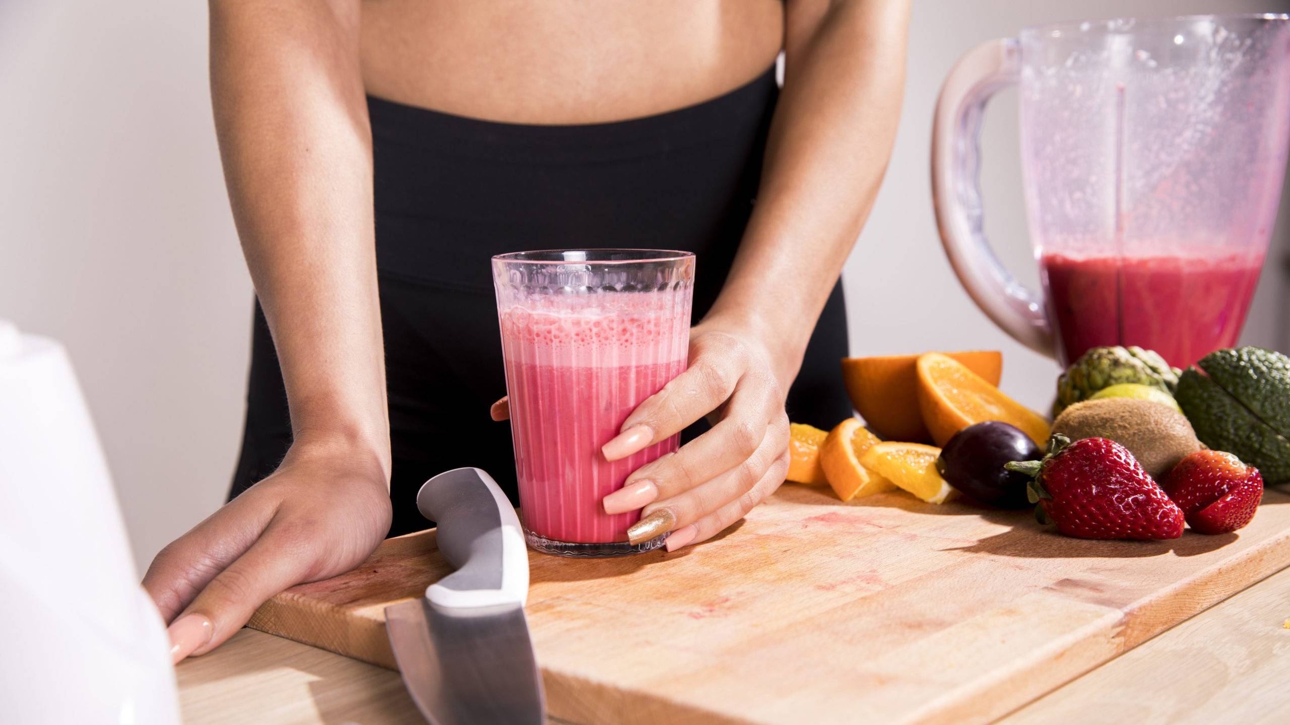 woman over 40 prepared a protein super shake.